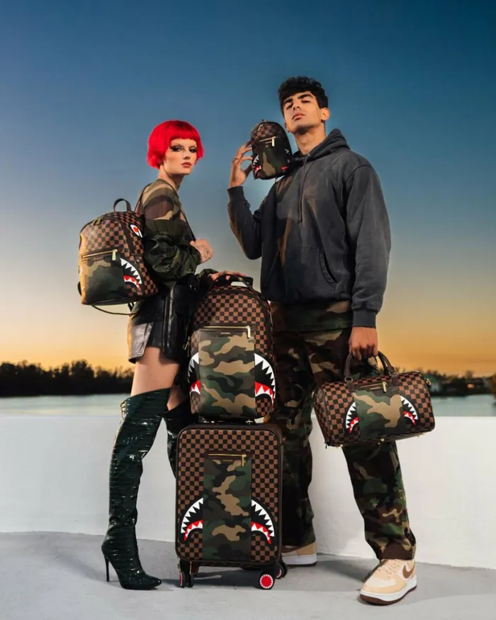 EXTERIOR GOLD ZIP POCKET SHARKS IN PARIS MESSENGER SLING BAG Bags SPRAYGROUND